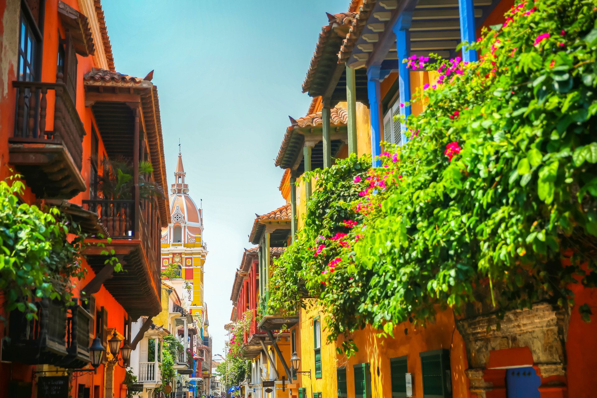 Lush balcony planters along the street looking towards town square in the old town of Cartagena Columbia